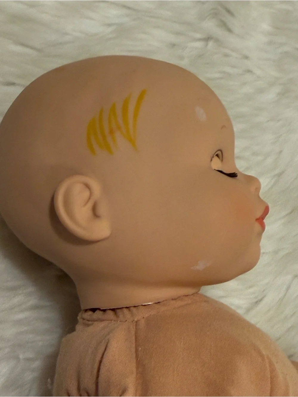 Madame Alexander 2010 Peach Vinyl Head Baby Doll with Blue Eyes